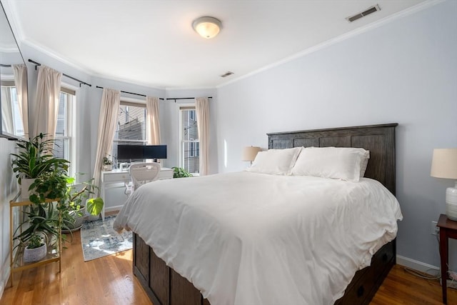 10 Peters Unit 2, Boston, MA 02127 - bedroom featuring ornamental molding and wood finished floors