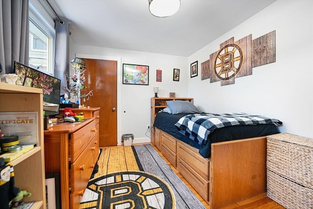 bedroom featuring light wood-type flooring