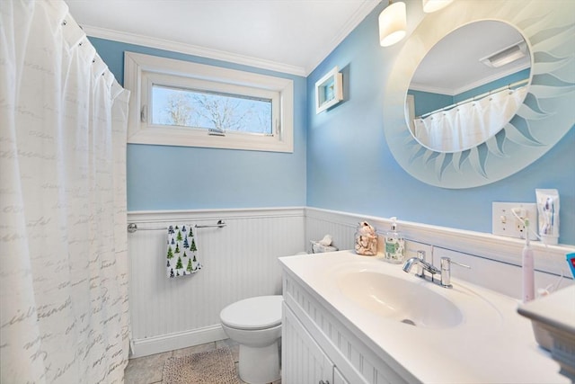 bathroom featuring vanity, tile patterned floors, ornamental molding, and toilet