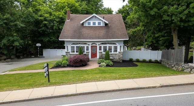 139 Washington St, Hudson, MA 01749 - view of front of property with stone siding and roof with shingles