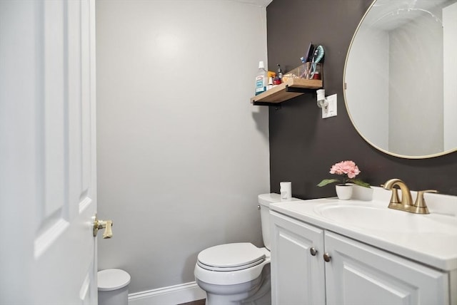 139 Washington St, Hudson, MA 01749 - half bathroom featuring toilet and vanity