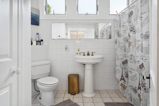 139 Washington St, Hudson, MA 01749 - bathroom with toilet, tile patterned floors, and curtained shower