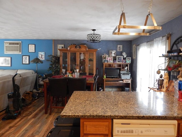 13 Lark St, New Bedford, MA 02745 - kitchen with wood finished floors, stone countertops, a wall mounted air conditioner, open floor plan, and white dishwasher
