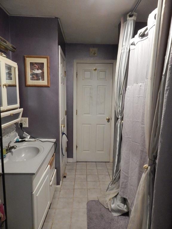 13 Lark St, New Bedford, MA 02745 - full bath with tile patterned floors, vanity, and a shower with shower curtain