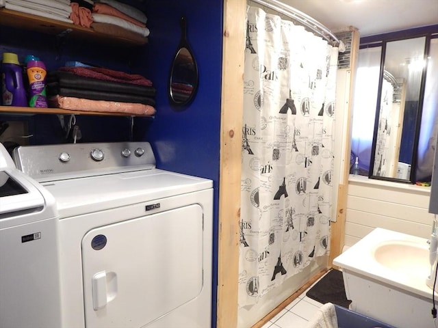 13 Lark St, New Bedford, MA 02745 - washroom featuring tile patterned floors, laundry area, and washer and dryer