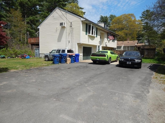 13 Lark St, New Bedford, MA 02745 - exterior space featuring an attached garage, driveway, and a chimney
