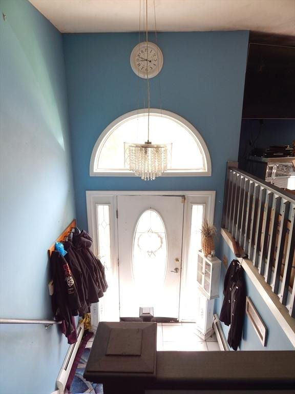 13 Lark St, New Bedford, MA 02745 - foyer with a chandelier, a baseboard radiator, and a high ceiling