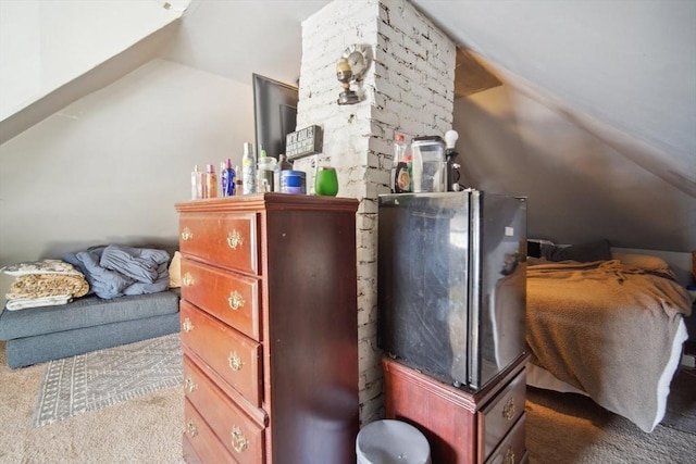 interior space with fridge, carpet, and lofted ceiling