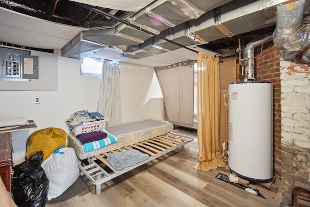 basement with electric panel, wood-type flooring, and water heater