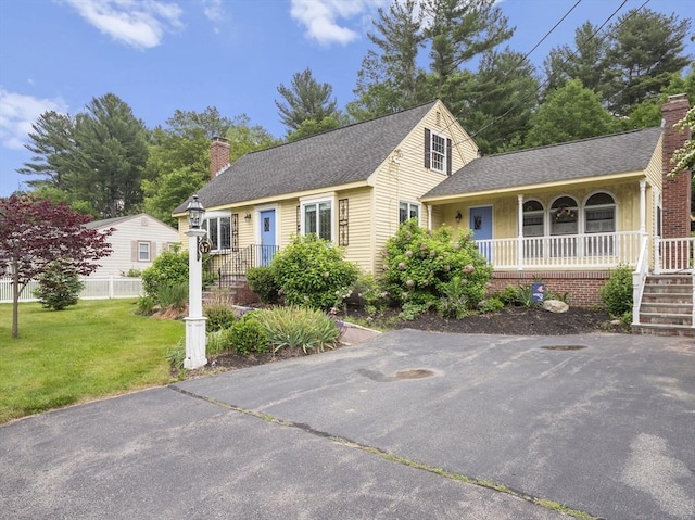 47 Skelton Rd, Burlington, MA 01803 - view of front of home featuring a chimney, a porch, a front yard, and a shingled roof