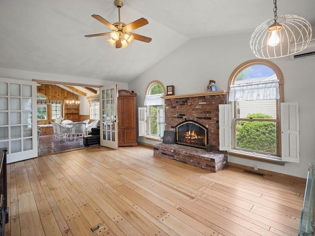 47 Skelton Rd, Burlington, MA 01803 - living area with vaulted ceiling, light wood finished floors, a ceiling fan, and plenty of natural light