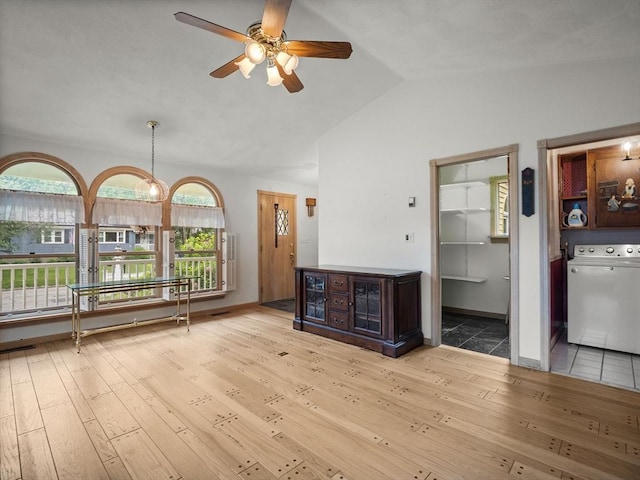 47 Skelton Rd, Burlington, MA 01803 - unfurnished living room with washer / dryer, a ceiling fan, lofted ceiling, and hardwood / wood-style flooring