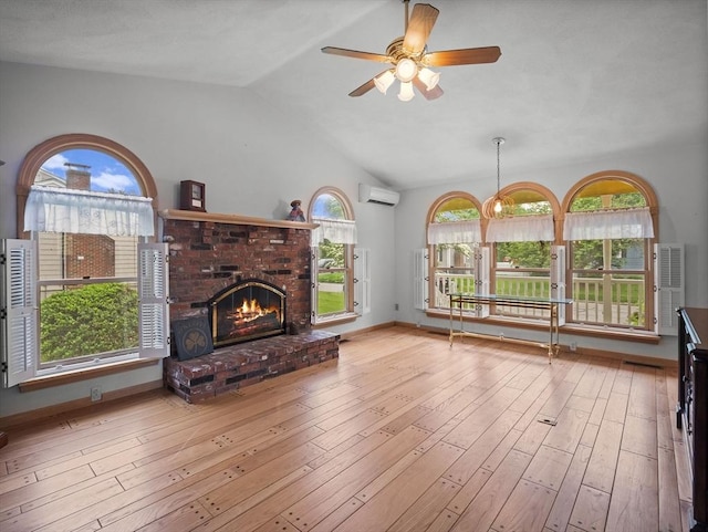 47 Skelton Rd, Burlington, MA 01803 - living room with a wall unit AC, lofted ceiling, a brick fireplace, a ceiling fan, and plenty of natural light