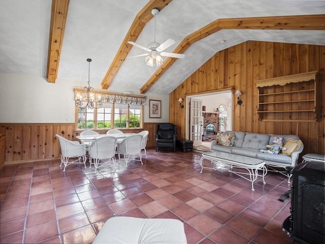 47 Skelton Rd, Burlington, MA 01803 - tiled living room with wooden walls, a chandelier, ceiling fan, and wainscoting