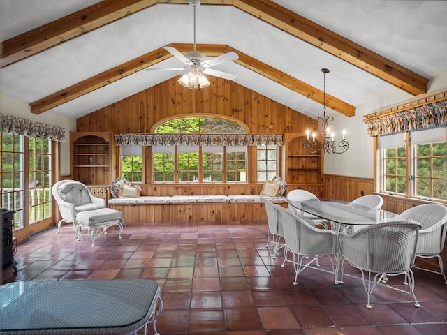 47 Skelton Rd, Burlington, MA 01803 - tiled dining room with wood walls, a chandelier, wainscoting, and a ceiling fan