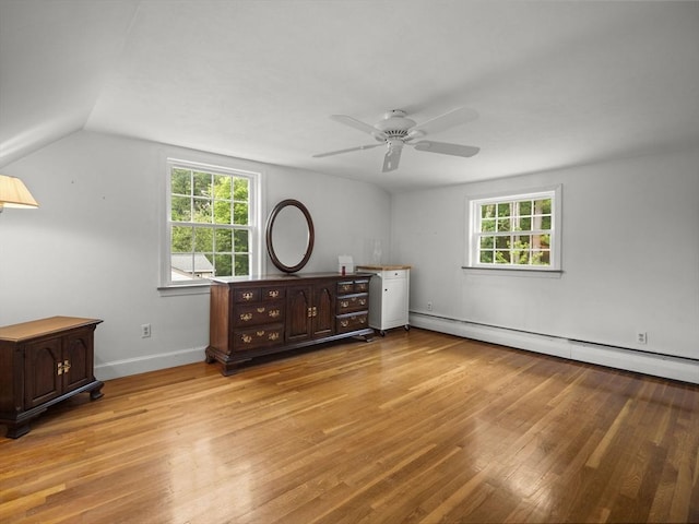 47 Skelton Rd, Burlington, MA 01803 - bedroom featuring light wood-style floors, a baseboard radiator, and multiple windows