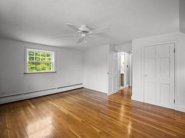 47 Skelton Rd, Burlington, MA 01803 - unfurnished room featuring a baseboard radiator, wood finished floors, and a ceiling fan
