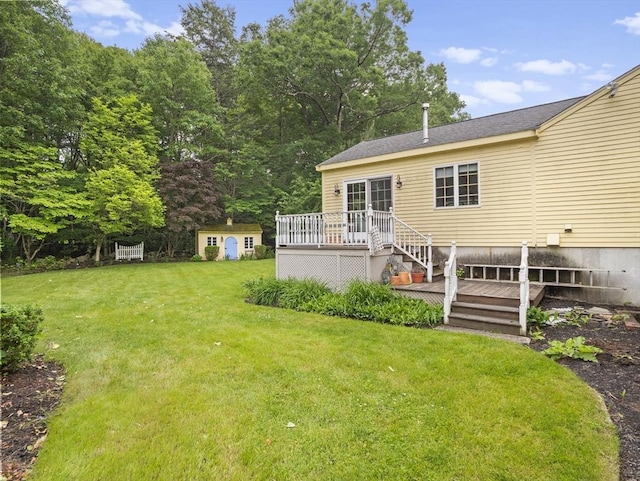 47 Skelton Rd, Burlington, MA 01803 - view of green lawn with a deck and a storage unit