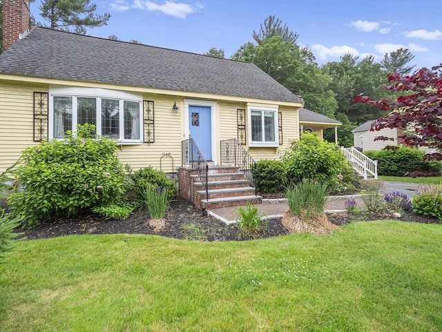 47 Skelton Rd, Burlington, MA 01803 - view of front of house with a front lawn, a chimney, and roof with shingles