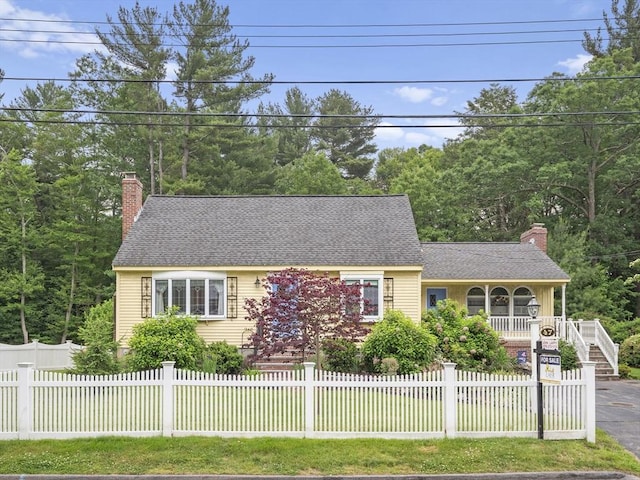 47 Skelton Rd, Burlington, MA 01803 - cape cod-style house with a chimney, a porch, a fenced front yard, and stairs