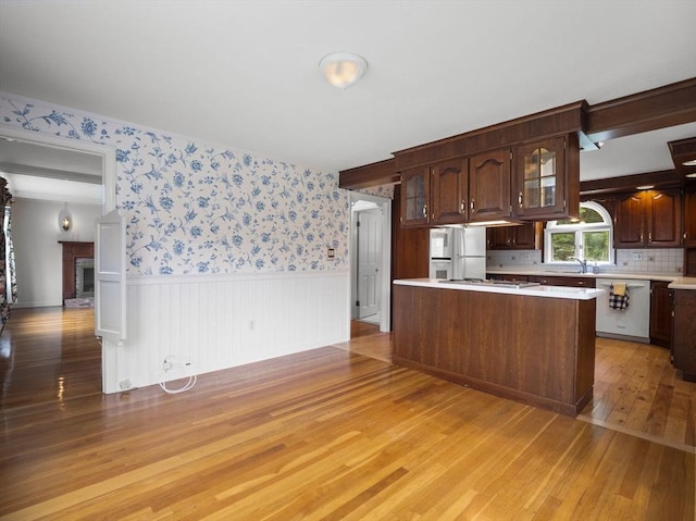 47 Skelton Rd, Burlington, MA 01803 - kitchen with white appliances, light wood-type flooring, light countertops, wainscoting, and glass insert cabinets