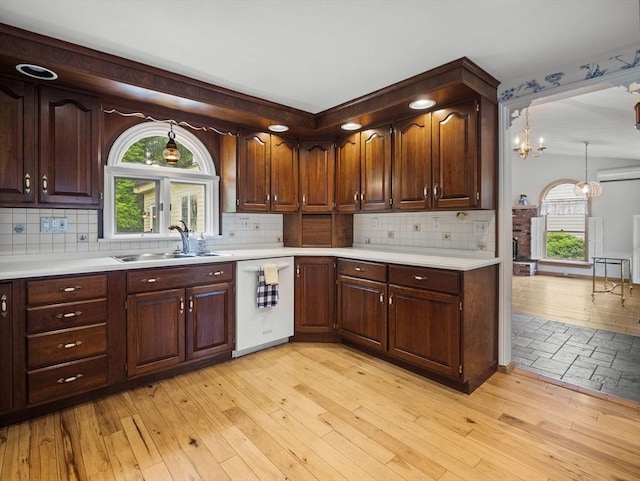 47 Skelton Rd, Burlington, MA 01803 - kitchen with dishwasher, light wood finished floors, light countertops, and decorative backsplash
