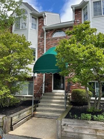 118 Tall Oaks Dr Unit D, Weymouth, MA 02190 - view of front facade with brick siding