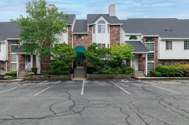 118 Tall Oaks Dr Unit D, Weymouth, MA 02190 - view of building exterior with uncovered parking and entry steps