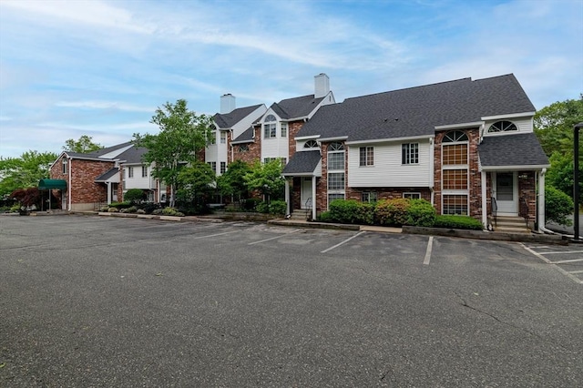 118 Tall Oaks Dr Unit D, Weymouth, MA 02190 - view of property featuring uncovered parking and a residential view
