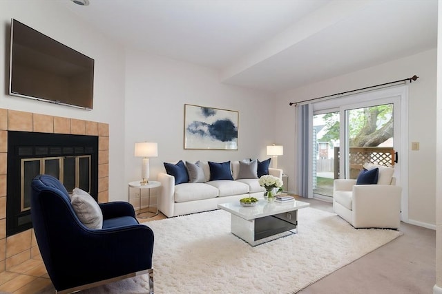 118 Tall Oaks Dr Unit D, Weymouth, MA 02190 - living room featuring a tiled fireplace and light carpet