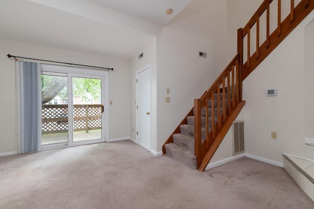 118 Tall Oaks Dr Unit D, Weymouth, MA 02190 - unfurnished living room featuring stairs, carpet flooring, and baseboards