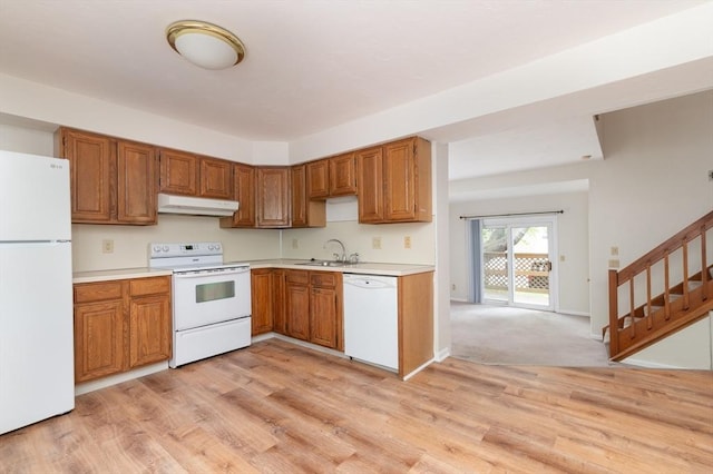 118 Tall Oaks Dr Unit D, Weymouth, MA 02190 - kitchen with white appliances, under cabinet range hood, a sink, and light countertops
