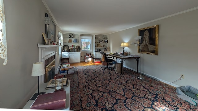 office featuring crown molding, built in features, and hardwood / wood-style flooring