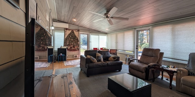 interior space with hardwood / wood-style flooring, ceiling fan, lofted ceiling, and wood ceiling