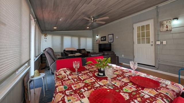 dining area featuring wood-type flooring, crown molding, wood ceiling, and vaulted ceiling