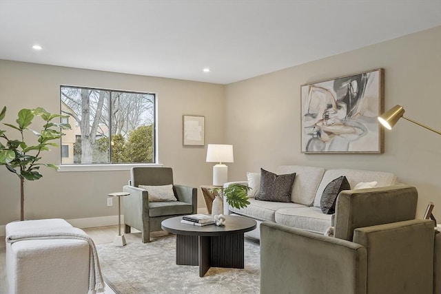 living area with recessed lighting, light wood-type flooring, and baseboards