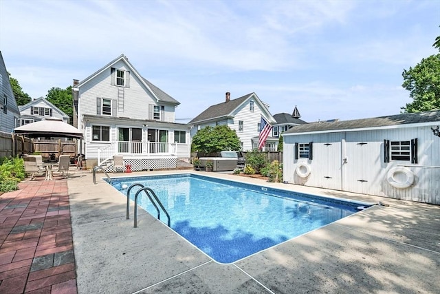 14 Giles Ave, Beverly, MA 01915 - view of pool with a gazebo, a patio, outdoor dining area, a sunroom, and a covered hot tub