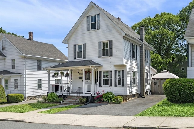 14 Giles Ave, Beverly, MA 01915 - view of front of property with a porch and a chimney