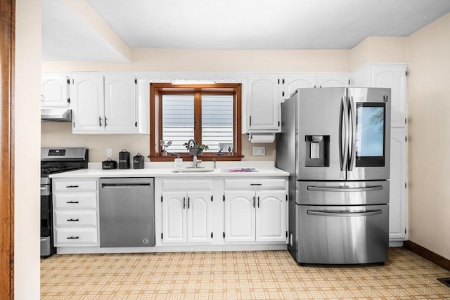 14 Giles Ave, Beverly, MA 01915 - kitchen featuring stainless steel appliances, wall chimney exhaust hood, white cabinets, and light countertops