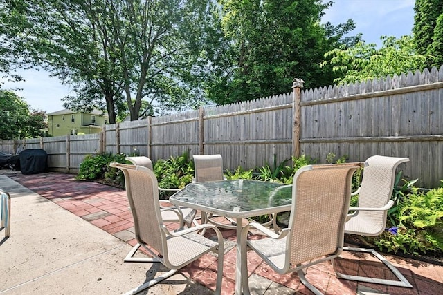 14 Giles Ave, Beverly, MA 01915 - fenced backyard featuring outdoor dining space and a patio