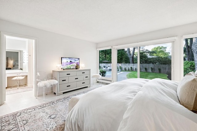 228 Atlantic Ave, Swampscott, MA 01907 - bedroom with access to outside, baseboard heating, and ensuite bath
