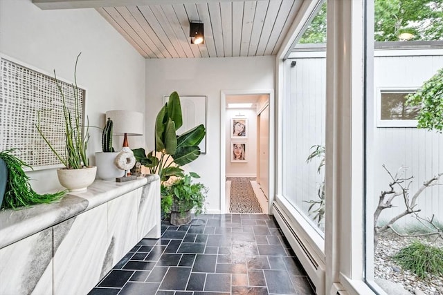 228 Atlantic Ave, Swampscott, MA 01907 - corridor featuring a baseboard radiator, dark stone finish flooring, plenty of natural light, and wood ceiling