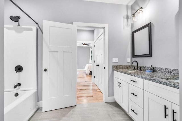 73 Depot Rd, Leverett, MA 01054 - full bath featuring vanity, baseboards, a ceiling fan, ensuite bath, and shower / washtub combination