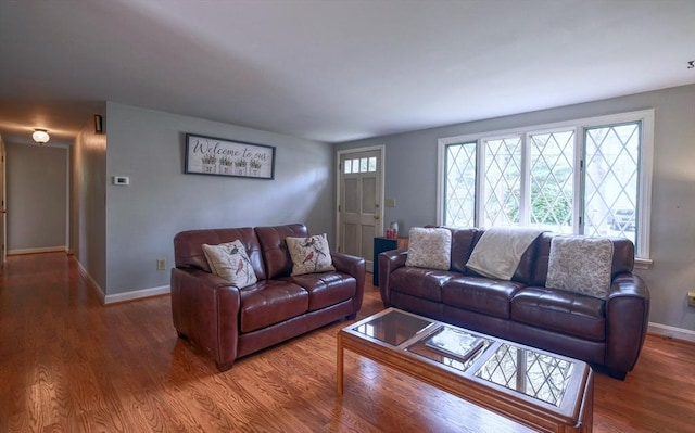 living room with wood finished floors and baseboards