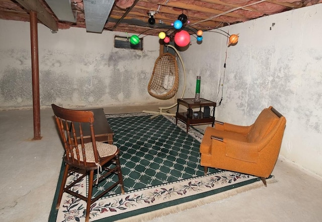 sitting room featuring concrete floors