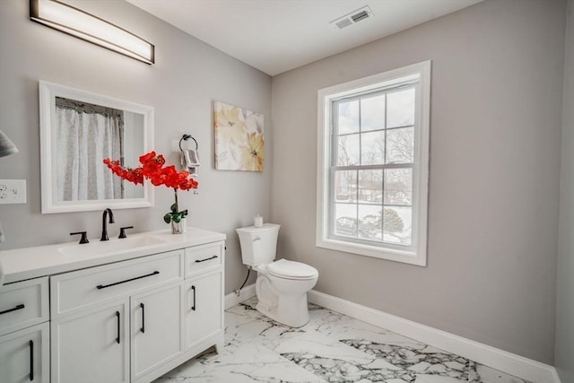 bathroom with marble finish floor, visible vents, toilet, vanity, and baseboards