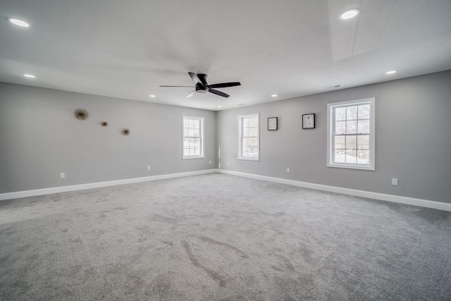 carpeted empty room featuring a ceiling fan, recessed lighting, and baseboards