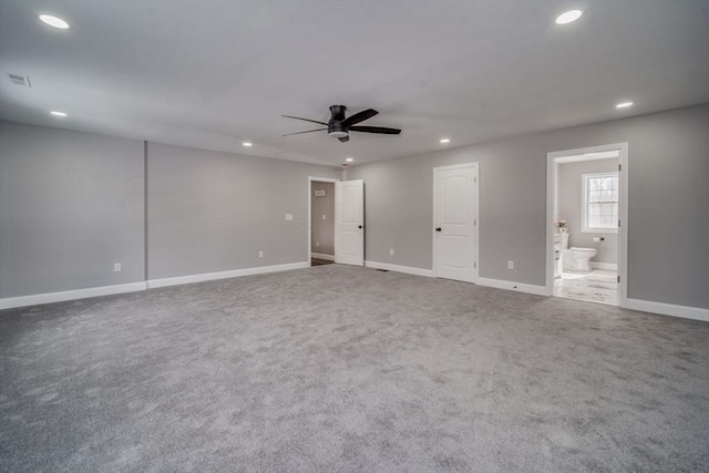 unfurnished bedroom with baseboards, carpet, ensuite bath, and recessed lighting