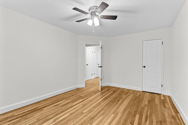 unfurnished bedroom with ceiling fan and light hardwood / wood-style flooring