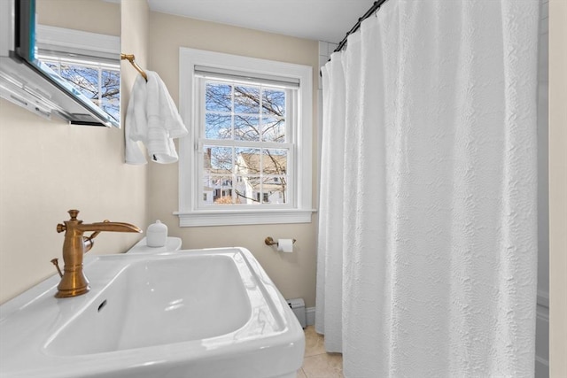 bathroom with tile patterned floors and sink